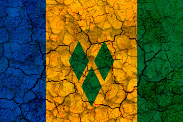 saint vincent and the grenadines country flag painted on a cracked grungy wall