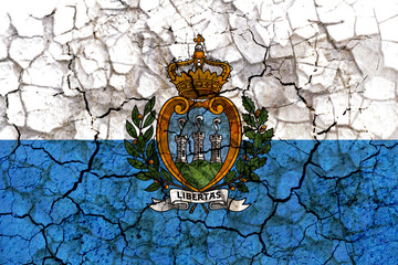 Fototapeta premium san marino country flag painted on a cracked grungy wall