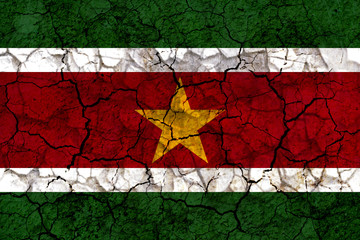 suriname country flag painted on a cracked grungy wall