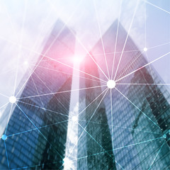 Blockchain network on blurred skyscrapers background. Financial technology and communication concept.