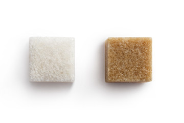 Close-up of white and brown sugar cubes, isolated on white background