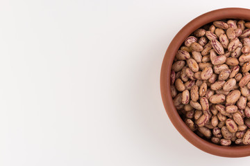 A plate of beans on white background.