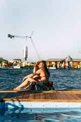 beautiful girl with long hair with a wakeboard