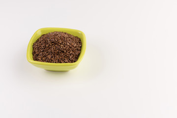 flax seeds in bowl on table background