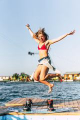 beautiful girl with long hair with a wakeboard