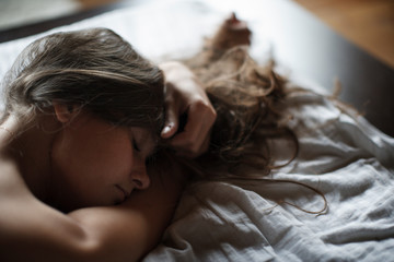Beautiful young girl posing in home photo studio