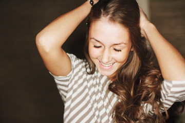 Fototapeta premium Beautiful young girl posing in home photo studio