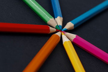 Coloured pencils isolated on the black background