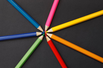 Fototapeta premium Coloured pencils isolated on the black background