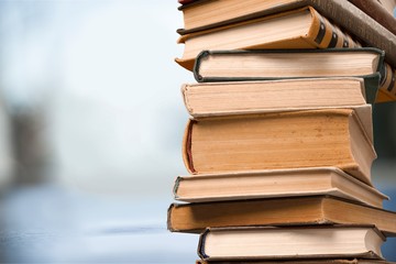 Books collection in pile on  background.
