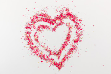 Valentine day concept, design. Small sugar decoration pattern on gray background. Flat lay, top view, copy space