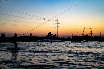 wakeboard. wakeboarding jumping at sunset