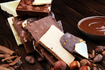 Chocolate bars on table with chocolate tower.
