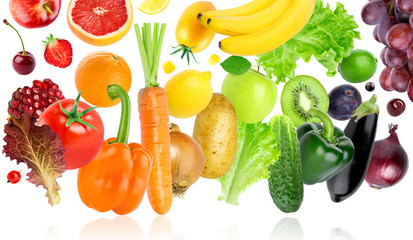 Falling of fruits and vegetables on white background