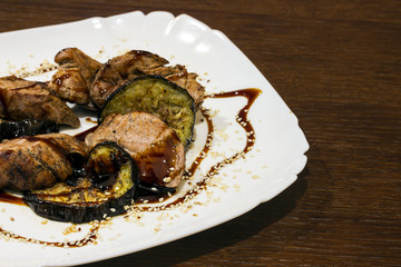 steak with roasted eggplant under soy sauce with sesame