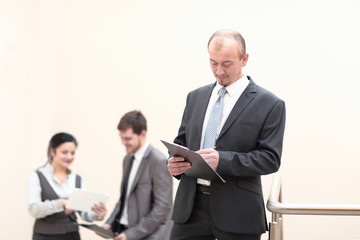 close up. businessman taking notes in clipboard