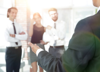 Fototapeta premium background image of businessman holding out hand for a handshake.