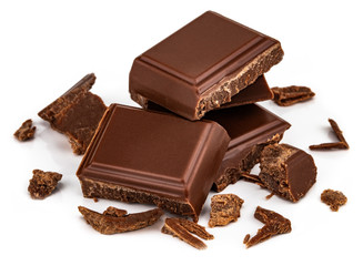 Milk chocolate pieces isolated on white background from top view