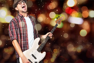 Obraz premium Portrait of a Musician Jumping while Playing an Electric Bass