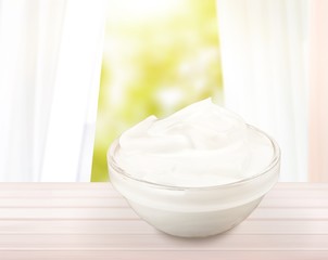 close up of a white beauty cream or yogurt on white background