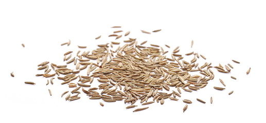 Pile of cumin, caraway seeds isolated on white background