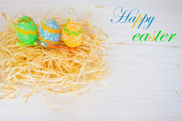 Easter eggs on a white wooden background. Easter background. Easter eggs. Easter. Easter symbol....
