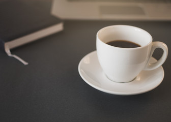 Workspace with laptop, notebook and morning coffee. Coffe before working. Top view
