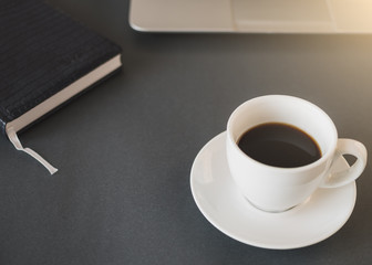 Workspace with laptop, notebook and morning coffee. Coffe before working. Top view