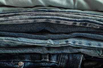 Jeans background.Jeans on a light background. Detail of nice blue jeans. Jeans texture or denim background. Blue denim jeans