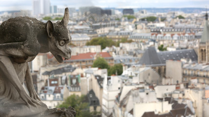 ancient statue of a gargoyle in the church of Notre Dame