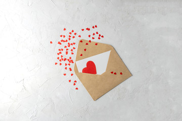 Isolated craft envelope with red paper hearts