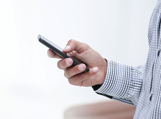 closeup.a man holds a smartphone.