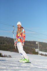 snowboarder on slopes in the sunny morning