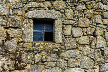 Fototapeta na wymiar Detail of the construction of a traditional local granite house of the rural architecture of the Beira Alta region in Portugal