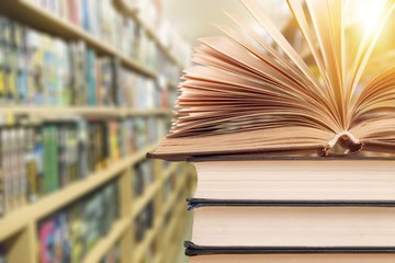 Old stacked books on background