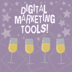 Writing note showing Digital Marketing Tools. Business photo showcasing Channels or platforms use in advertising a product Filled Cocktail Wine Glasses with Scattered Stars as Confetti Stemware