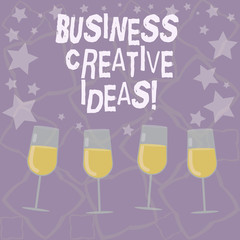 Writing note showing Business Creative Ideas. Business photo showcasing Concept that can be used for financial gain Filled Cocktail Wine Glasses with Scattered Stars as Confetti Stemware