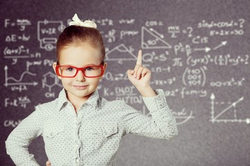 Portrait of a cute young boy with glasses isolated on