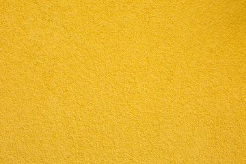 Texture of yellow concrete wall