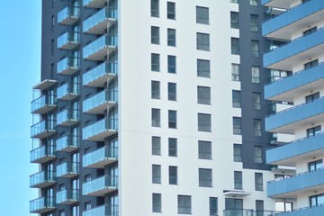 Modern apartment buildings on a sunny day with a blue sky. Facade of a modern apartment building