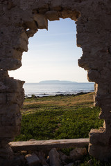 Island framed by ruins