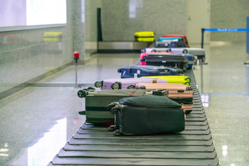 Suitcases on Baggage Claim Conveyor Belt at the International Airport