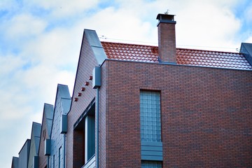 Modern apartment buildings on a sunny day with a blue sky. Facade of a modern apartment building