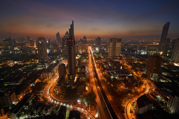 Fototapeta premium beautiful sunrise skyline and amazing lighting up on bridge and street with cityscape view