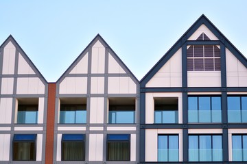 Modern apartment buildings on a sunny day with a blue sky. Facade of a modern apartment building