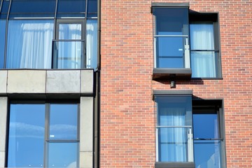 Modern apartment buildings on a sunny day with a blue sky. Facade of a modern apartment building