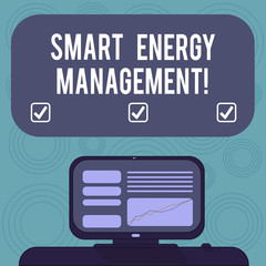 Conceptual hand writing showing Smart Energy Management. Business photo showcasing Lessen consumer dependence on conventional energy Mounted Computer Screen with Line Graph on Desk Text Box