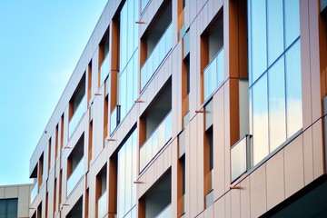 Modern apartment buildings on a sunny day with a blue sky. Facade of a modern apartment building