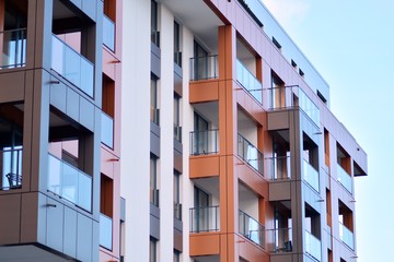 Modern apartment buildings on a sunny day with a blue sky. Facade of a modern apartment building