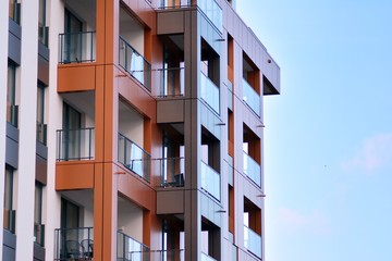 Modern apartment buildings on a sunny day with a blue sky. Facade of a modern apartment building